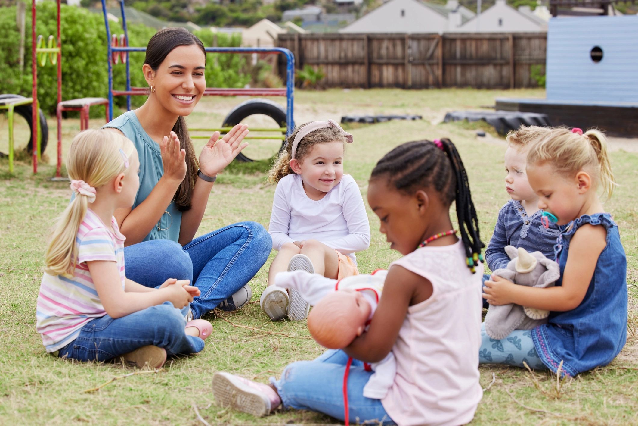 Children exploring and learning outdoors at daycare