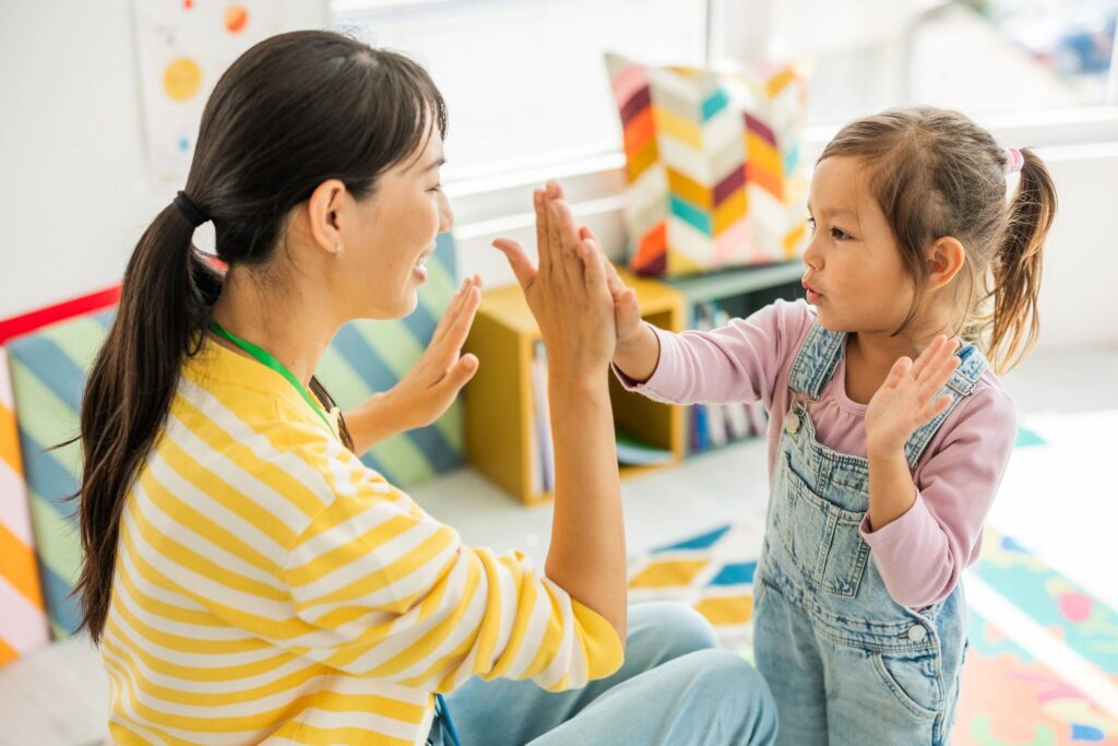 happy teachers with children daycare